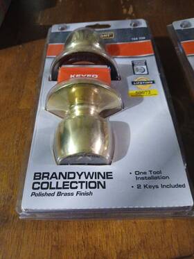 T8700b Defiant Brandywine Polished Brass Keyed Entry Door Knob
