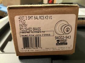 94002-943 Kwikset Tylo Polished Brass Entry Knob Door Lock
