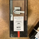 Baldwin Smartkey Prestige Series Satin Nickel Spyglass Lever Keyed Entry, New. Fixed Price $50.00.