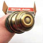 Schlage Door Knob Bright & Antique Brass Passage Latch Geo F10N Nos. Fixed Price $17.99.