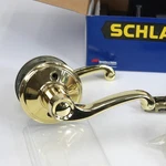 Schlage Flair Reversible Passage Lever Set In Brass F10 605. Fixed Price $10.00.