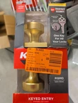 Kwikset Pismo Satin Brass Keyed Entry Square Door Knob Featuring Smartkey. Fixed Price $36.00.