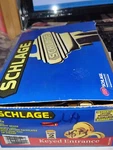 Schlage Accent Bright Brass Keyed Entrance Door Knob Locking Curvy Handle. Fixed Price $22.99.
