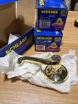 Three Schlage Flair Left Handdummy Nonturning Lever Bright Brass F170FLA605LH. Fixed Price $89.25.
